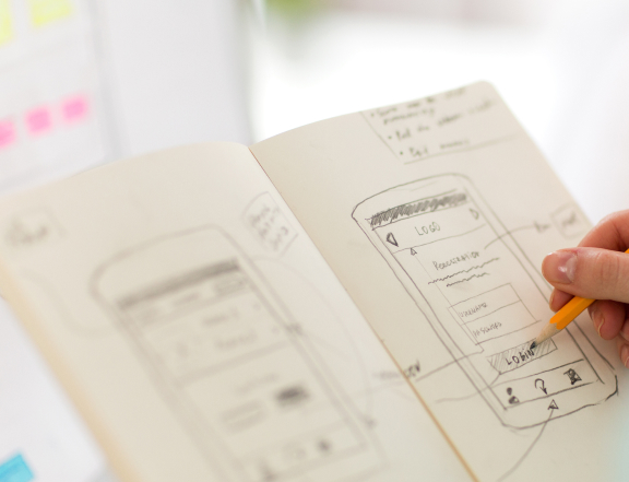 a person sketching a website wireframe